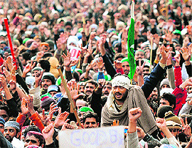 Supporters of Pakistani cleric Tahirul Qadri chant slogans at a protest rally in Islamabad on January 17. The cleric's central message  "forget politics, save the state"  is no different from the long-standing slogan of Pakistan's powerful military establishment