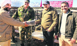 Army officers distribute present sports items to schools during a function in Mahore on Thursday. A Tribune photograph