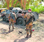 French soldiers inspect an armoured vehicle in Diabaly on Wednesday.