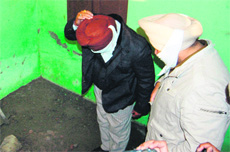 A police team inspects the site from where the body was recovered. 
