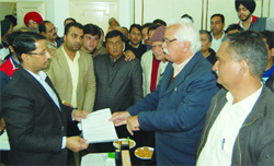 Members of the Rice Shellers Association submit a memorandum to Industry Minister Anil Joshi in Amritsar on Friday.