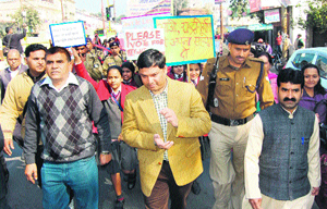 District Election Officer Sachin Kurwe and coordinator of the voters day rally Dr Naresh Chaudhary during an awareness drive in Haridwar on Friday.