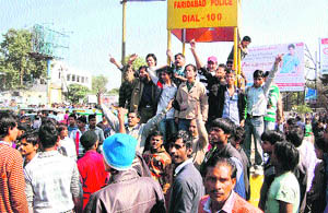 Residents block traffic in protest against a womans murder in NIT-5 (Faridabad) on Friday. 