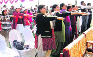 Participants take oath to vote in a free and fearless manner at a function held in Manohar Memorial Postgraduate College in Fatehabad on Friday. 