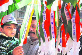  A boy purchases the Tricolour on the eve of Republic Day in Jammu on Friday. 