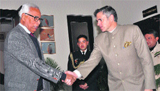 Governor NN Vohra shakes hands with Chief Minister Omar Abdullah at the Raj Bhawan in Jammu on Friday. 