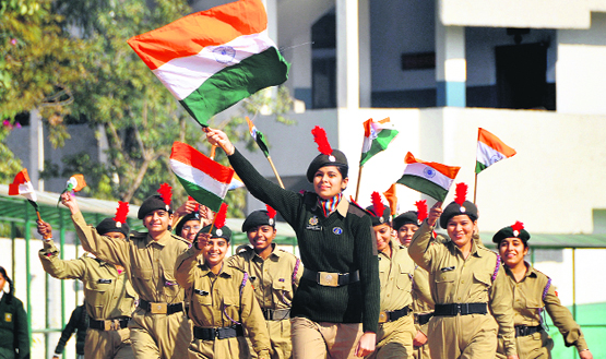 Young Patriots NCC cadets wave National Flags to celebrate Republic Day in Ludhiana on Friday.