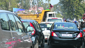 A truck of the A2Z company parked in the middle of the road outside the Khalsa College for Women in Ghumar Manai, Ludhiana. 