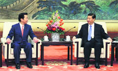Chinas general secretary of the Central Committee of the Communist Party Xi Jinping with Natsuo Yamaguchi (L), leader of Japan's New Komeito party, in Beijing on Friday.  Reuters