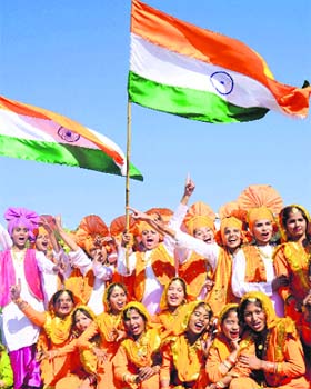 Students all smiles after winning the first prize in a cultural item during a R-Day function at Parade ground in Sector 17, Chandigarh, on Saturday