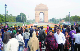 Many people visit India Gate after the Republic Day parade in New Delhi on Sunday. 