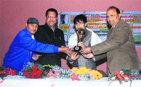 Parimarjan Negi, famous chess player, being felicitated by Devender Bhasin, Principal of DAV (PG) College, and Suryakant Dhasmana,vice-president of the Uttarakhand Congress at a function in Dehradun on Sunday