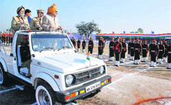 Chief Minister Bhupinder Singh Hooda takes the salute at the Republic Day march past in Rewari.