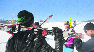 A group of youths in full skiing gear at Gulmarg on Sunday. 