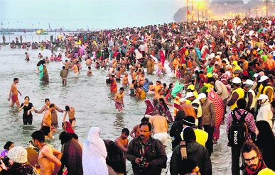 Devotees take a holy dip in the Ganga on Paush Purnima during Mahakumbh in Allahabad