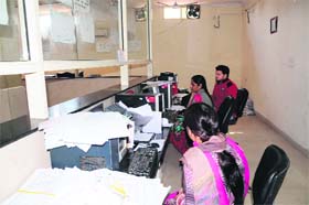 Members of the Punjab Health Department Subordinate Offices Clerical Association hold a pen-down strike at Civil Surgeon Office in Amritsar on Monday