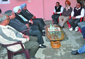 Chief Parliamentary Secretary Sarup Chand Singla (second from left) at a meeting with the members of the Bathinda Estate Agents Association on Monday. 