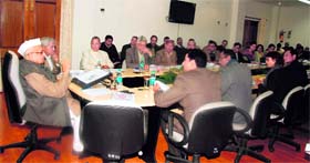Governor Aziz Qureshi holds a meeting with Red Cross officials at Raj Bhavan in Dehradun on Monday.