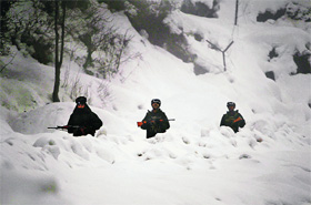 Indian soldiers patrol the Line of Control in Jammu and Kashmir. The Army has to not only defend it, but also prevent infiltration through gaps in between border outposts, much of it which is in bad weather, difficult terrain and in proximity of the enemy