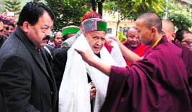 Chief Minister Virbhadra Singh is welcomed at the Buddhism Research Centre in Bhattoo, near Baijnath, on Monday.