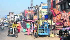 Encroachments by vendors on the either side of the Hoshiarpur road in Rama Mandi lead to traffic congestion in the area in Jalandhar