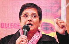Kiran Bedi addresses students at a function to award scholarships in Jammu on Monday.