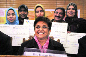 Former IPS officer Kiran Bedi with students at Kashmir University in Srinagar on Monday. 