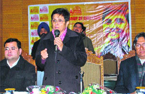 Kiran Bedi addresses the audience at a seminar while Vice-Chancellor of  University of Kashmir (KU), Talat Ahmed (right) looks on at KU in Srinagar on Monday. 