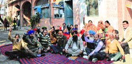 The clerical staff of the Health Department hold a protest in Ludhiana on Monday.