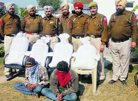 The accused in police custody at Dehlon.