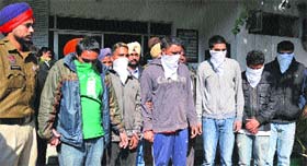 Six members of the Lakhi gang in police custody in Ludhiana on Monday.