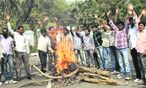 Students of Osmania University in Hyderabad hold a protest demanding a separate state of Telangana on Monday
