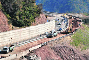 Repair work under way on a damaged stretch of the Pinjore-Parwanoo bypass on Monday. 