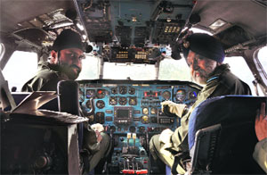Air Cmde RS Sodhi (right) with his son Flt Lt Angad Singh in the cockpit of an IAF AN-32 aircraft at Vadodara on Monday. 