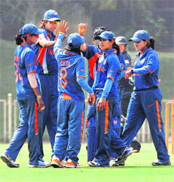 The Indian women celebrate taking a New Zealand wicket in their warm-up match in Mumbai on Monday. India won the match by eight wickets as Poonam Raut scored 69 after Jhulan Goswami had taken three wickets.