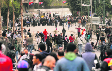 Egyptian protesters clash with police near Cairos Tahrir Square on Monday.