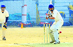 A player in action during a cricket match held between United 11 and Vivek Club in Chandigarh on Tuesday