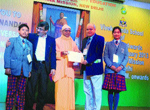 Arvind Dogra, Director, Noorpur Public School, receives the award in Nurpur.