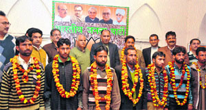 BJP leaders with new party members during a function in Jammu on Tuesday. 