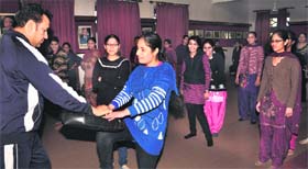 Students of Kanya Maha Vidyalaya being imparted training in karate for self-defence in Jalandhar on Tuesday.