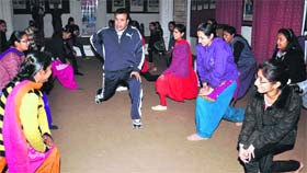Students of Kanya Maha Vidyalaya being imparted training in karate for self-defence in Jalandhar on Tuesday.