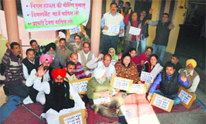 Congress councillors protest against the MC at the Zone A office in Ludhiana on Tuesday. 