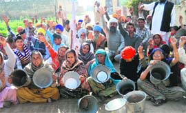 Residents of Chutala village, near Tarn Taran, protest against scarcity of drinking water on Tuesday.