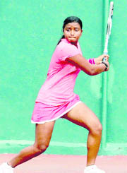 A player in action during a match in the All-India Talent Series Tennis Tournament in Dehradun on Wednesday. 