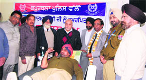 A policeman donates blood at a camp to commemorate Martyrs Day in Phagwara on Wednesday. 