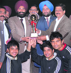 The winning team of Aligarh Muslim University with the trophy of the North Zone Inter-University Lawn Tennis (Men) Championship in Jalandhar. 