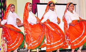 Riot of colours: Students of the Department of Sociology, University of Jammu, perform during their alumni meet at Rajindera Auditorium of the varsity in Jammu on Wednesday