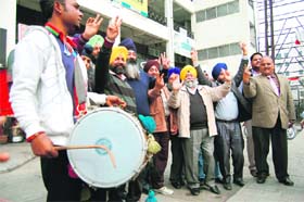 SAD workers celebrate the partys victory in the Delhi Sikh Gurdwara Management Committee elections, in Amritsar on Wednesday