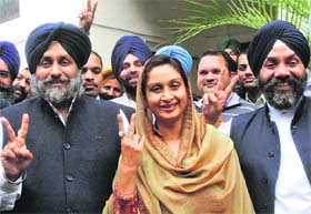 From Left: Sukhbir Badal, Harsimrat Badal and SAD Delhi unit chief Manjit Singh GK flash the victory sign in New Delhi on Wednesday