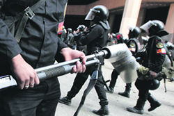 Policemen take up positions during clashes in Cairo on Wednesday. 
